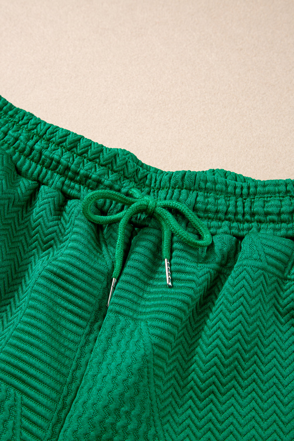 Dark green textured ruffle split top with drawstring shorts, Modern Grace two-piece set, casual summer clothing for women.
