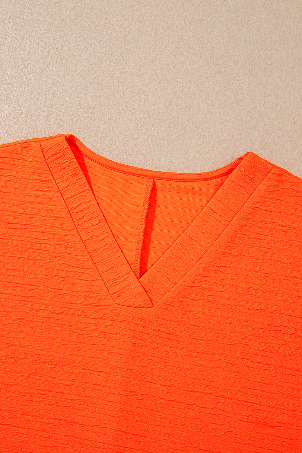 Orange textured V-neck T-shirt and matching shorts set by Modern Grace, featuring a relaxed fit and casual style.