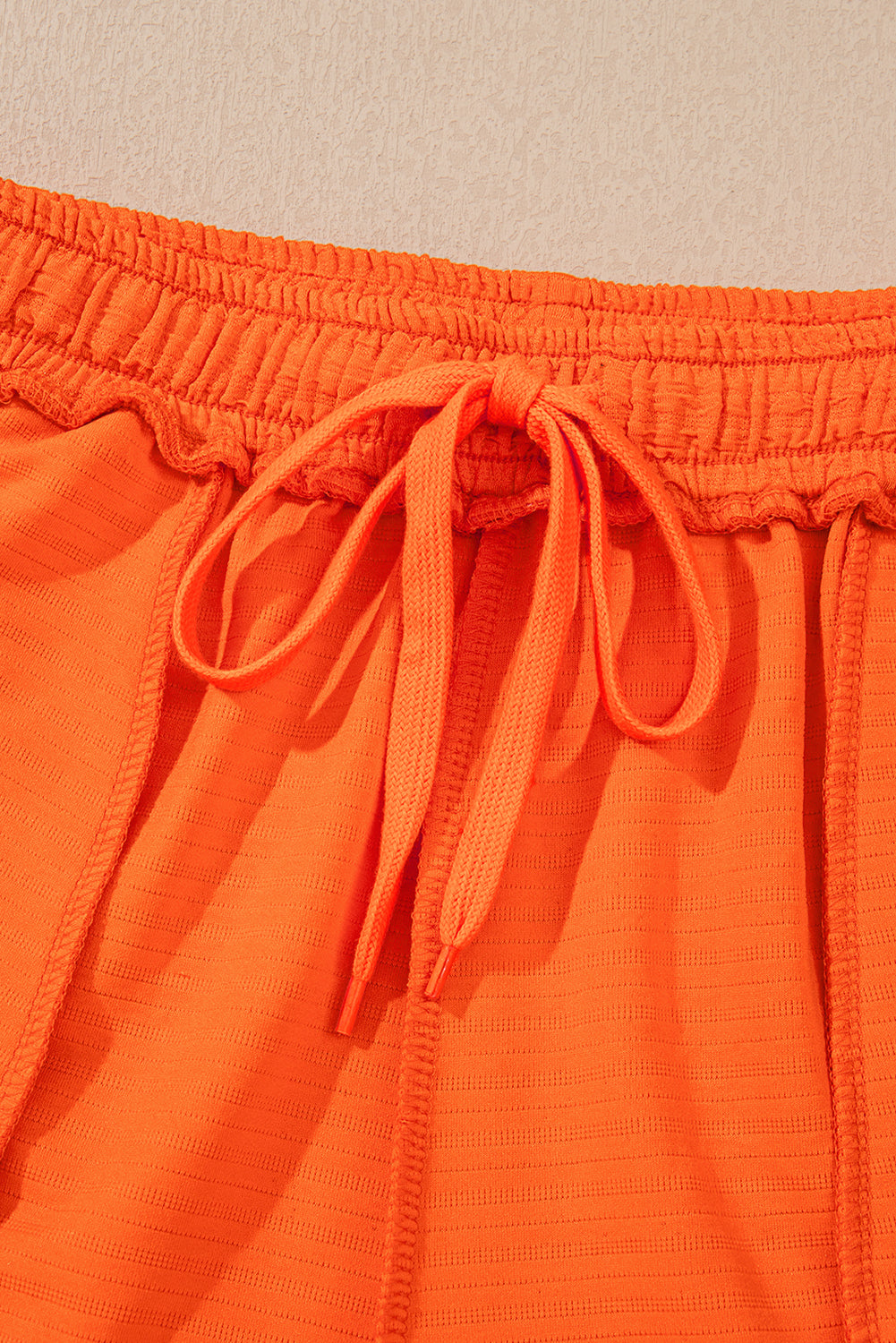 Orange textured V-neck T-shirt and shorts set by Modern Grace, casual two-piece short set with stretchy fabric.