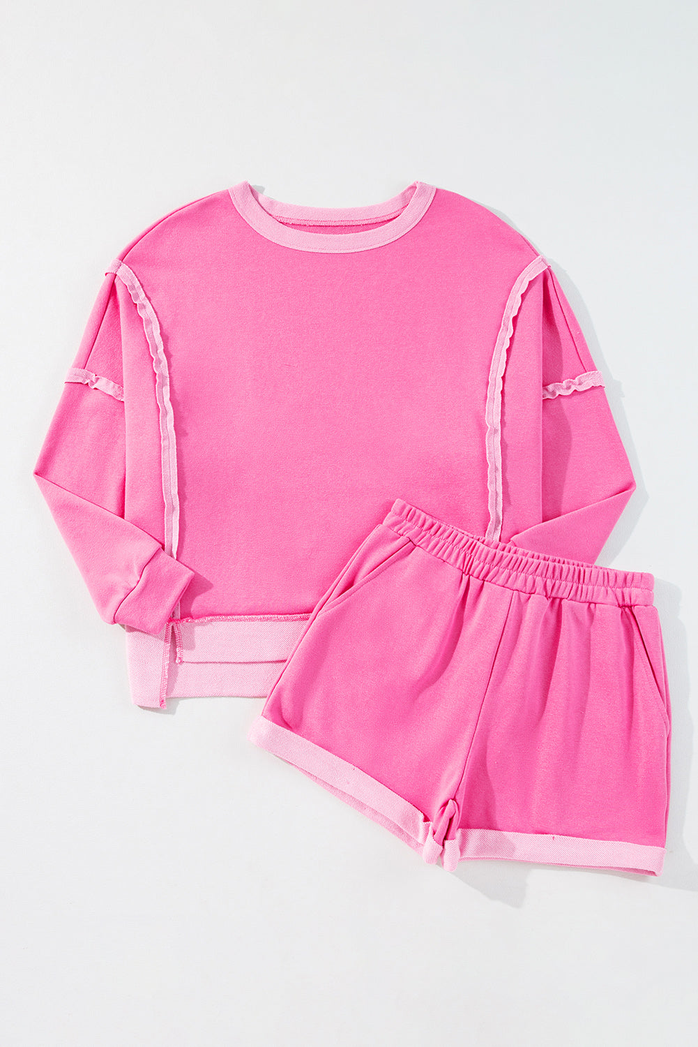 Modern Grace pink patchwork long sleeve top and matching shorts set, high-low design, two-piece polyester cotton fashion ensemble.