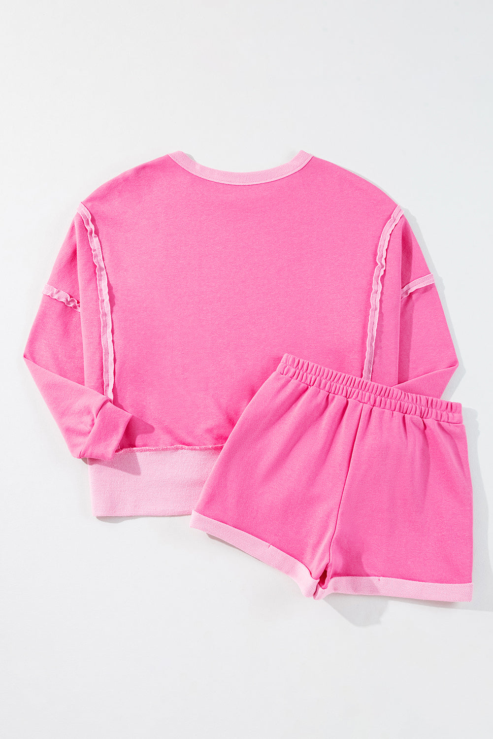 Modern Grace pink high-low patchwork long sleeve top and shorts set, stylish two-piece outfit with a casual, trendy look.