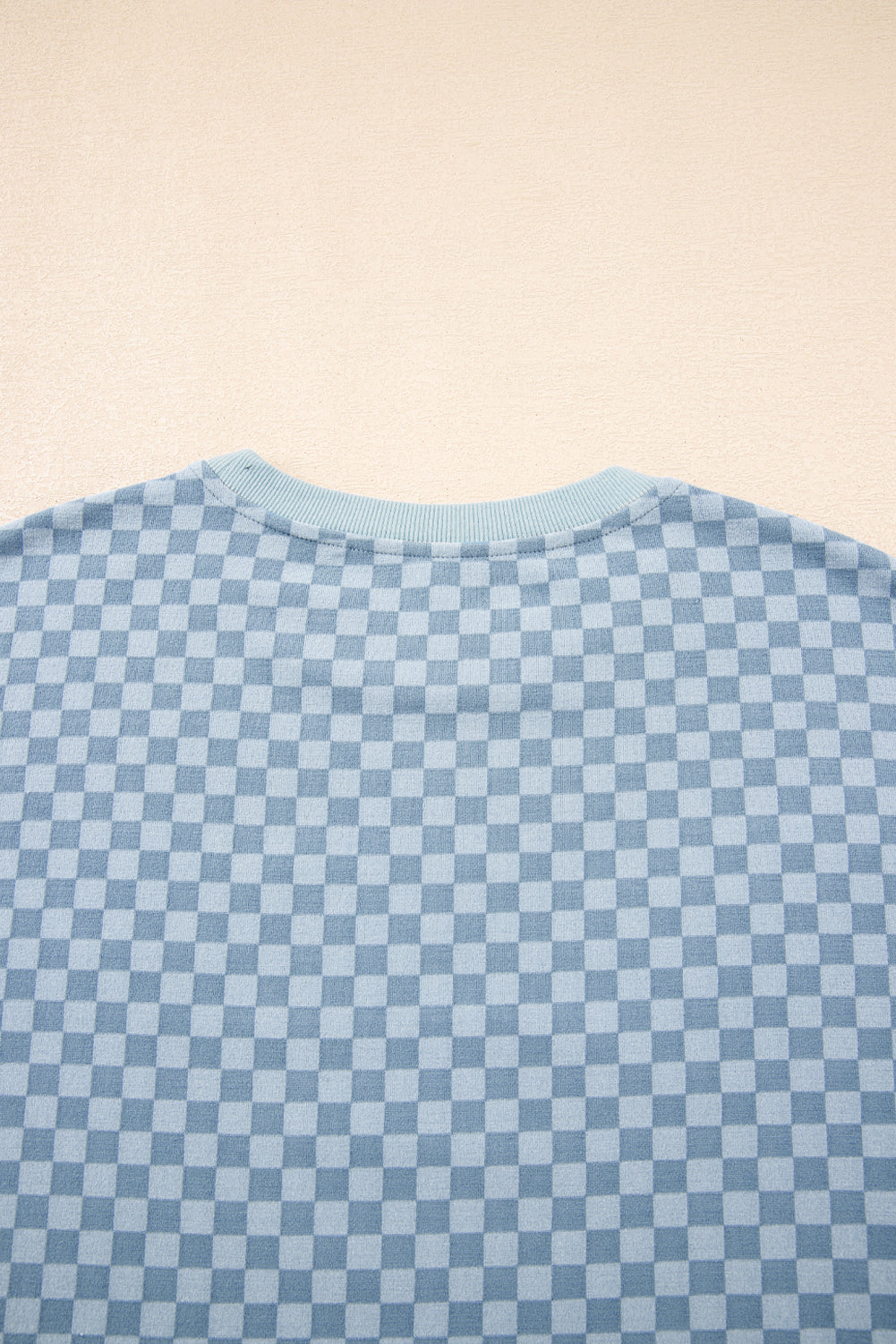 Blue checkerboard long sleeve pullover and shorts set by Modern Grace, featuring a casual two-piece outfit with a relaxed fit.