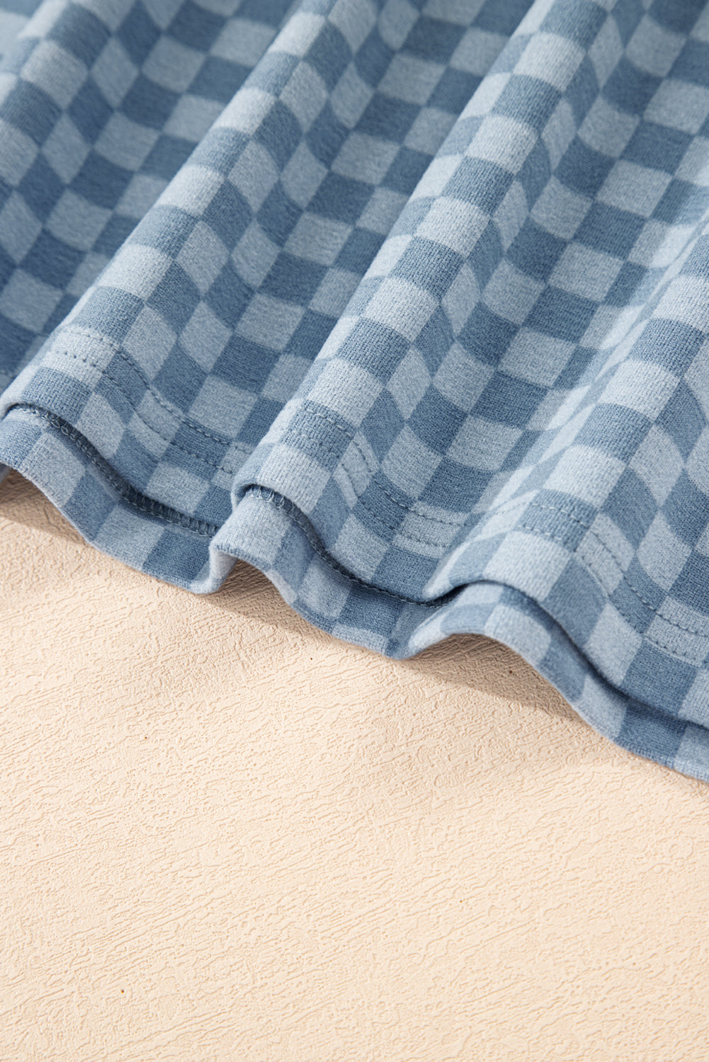 Sky blue checkerboard long sleeve pullover and shorts set by Modern Grace, featuring a casual two-piece design.