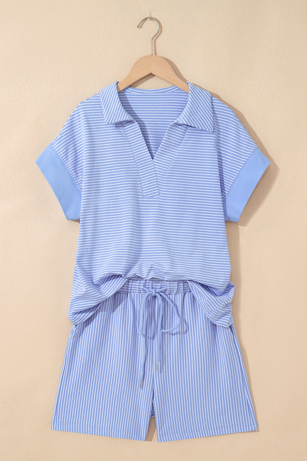 Sky blue stripe dolman sleeve polo shirt and matching drawstring shorts set by Modern Grace, made of cotton and elastane.