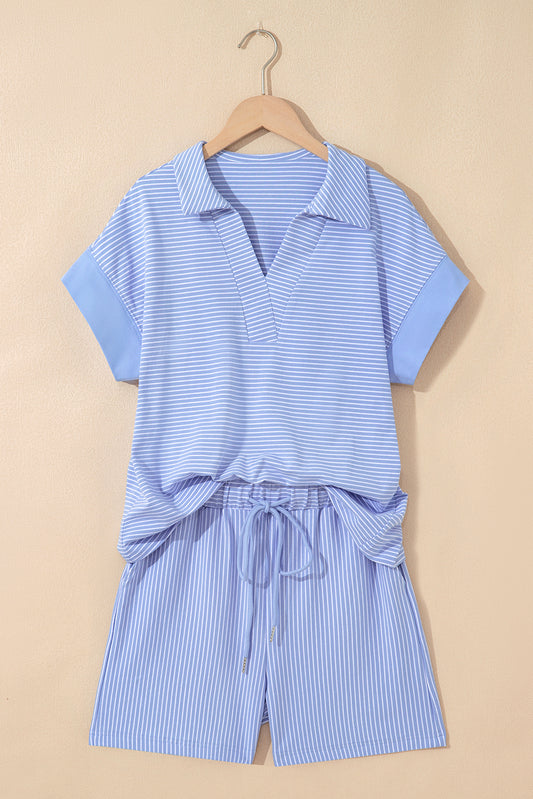 Sky blue stripe dolman sleeve polo shirt and matching drawstring shorts set by Modern Grace, made of cotton and elastane.