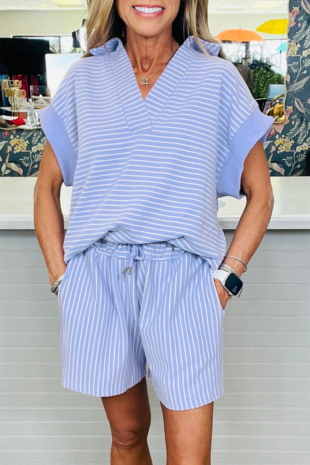 Modern Grace sky blue stripe polo shirt and drawstring shorts set, soft cotton-elastane blend, dolman sleeves, casual two-piece outfit.
