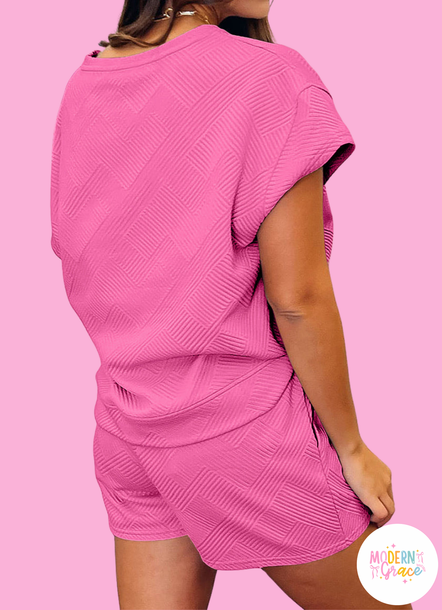 Modern Grace strawberry pink two-piece shorts set with textured fabric, drawstring waist, ideal for casual summer wear.