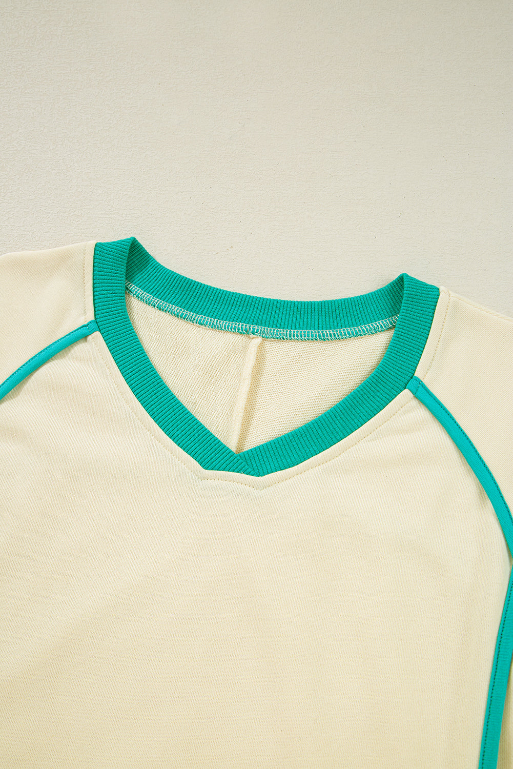 Modern Grace colorblock long sleeve pullover and drawstring shorts two-piece set, casual comfortable outfit for women.