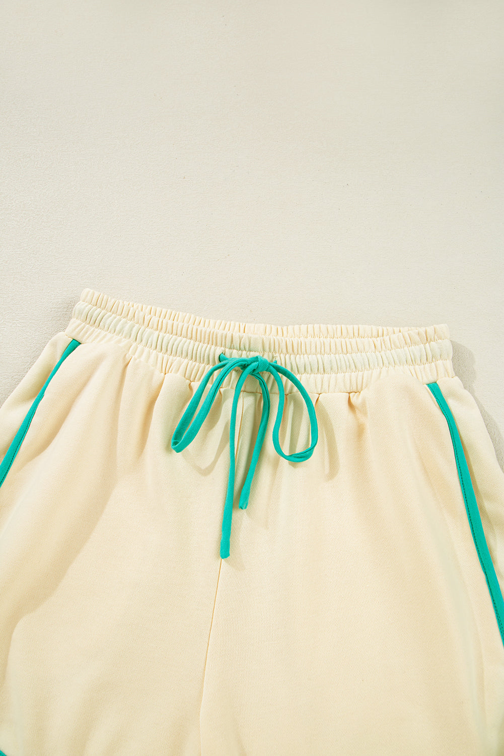 Modern Grace colorblock long sleeve pullover and drawstring shorts two-piece set, casual stylish loungewear outfit.