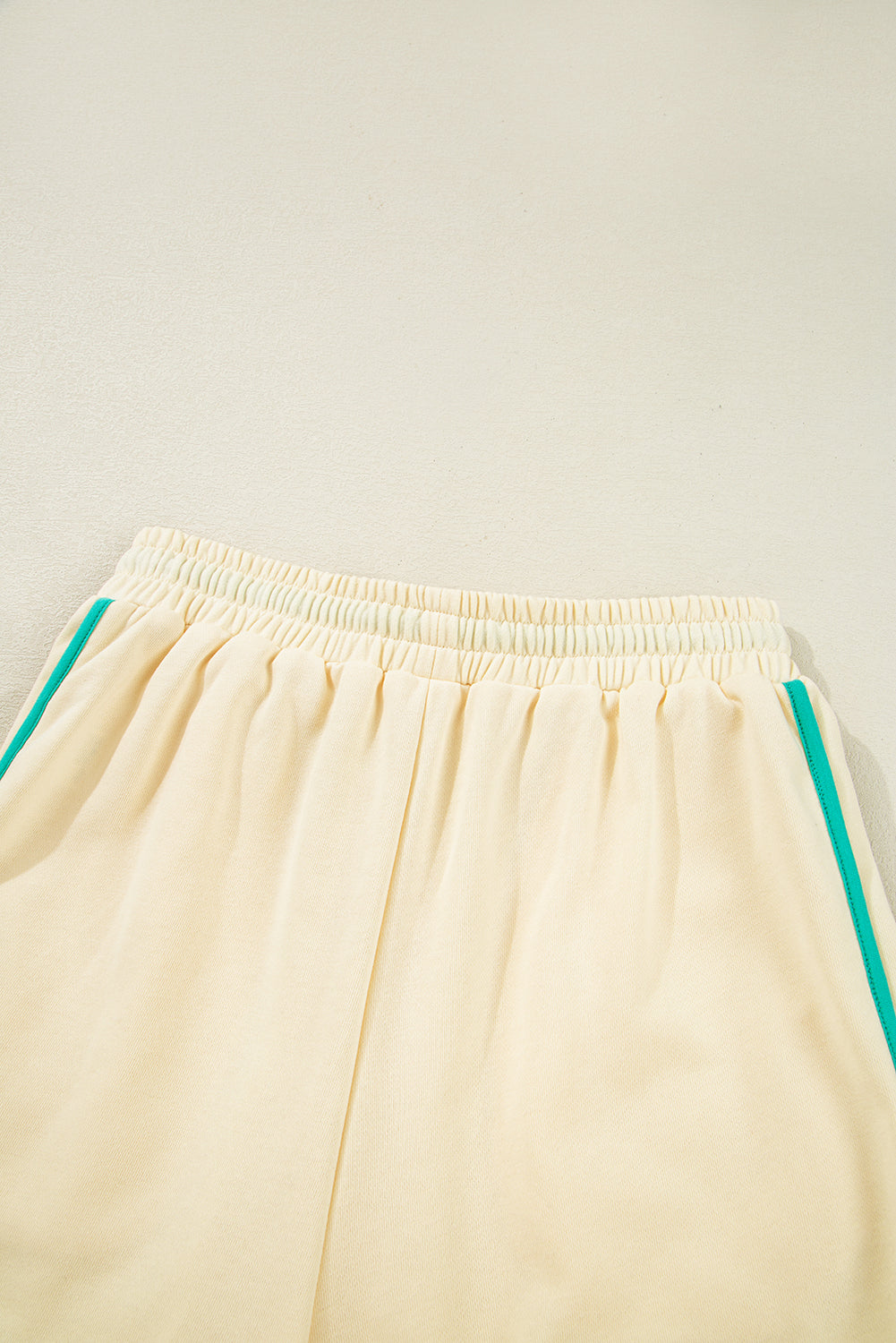Modern Grace colorblock long sleeve pullover and drawstring shorts two-piece set, casual and stylish for everyday wear.