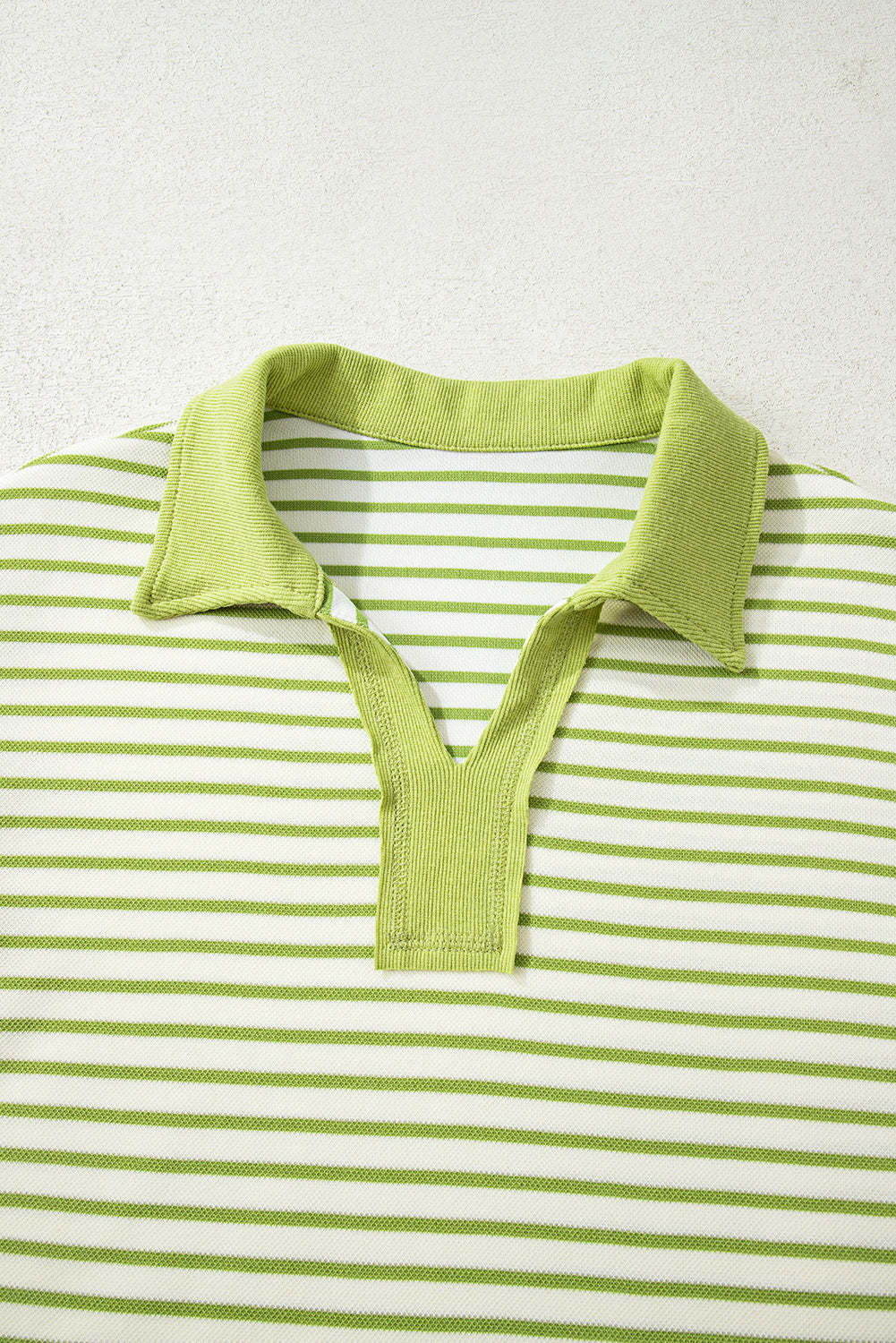 Modern Grace green stripe two-piece set with collared V-neck pullover and matching skort, casual and stylish outfit.