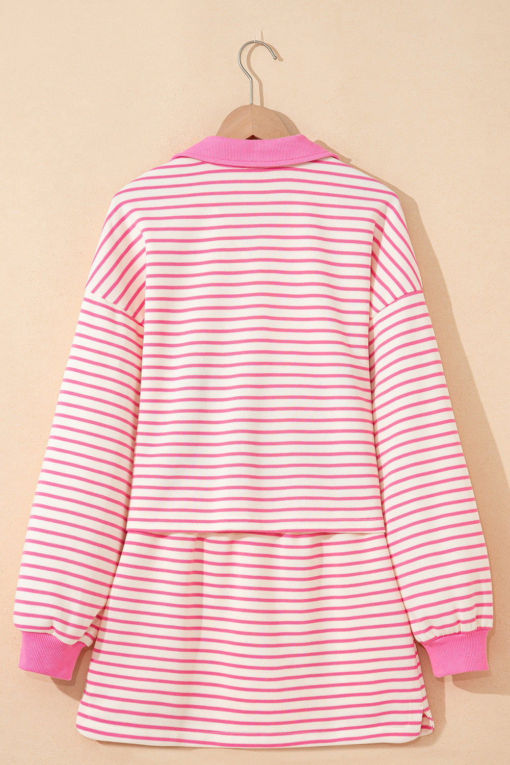Pink stripe collared V-neck pullover and matching skort set from Modern Grace, featuring drop shoulder design and casual style.