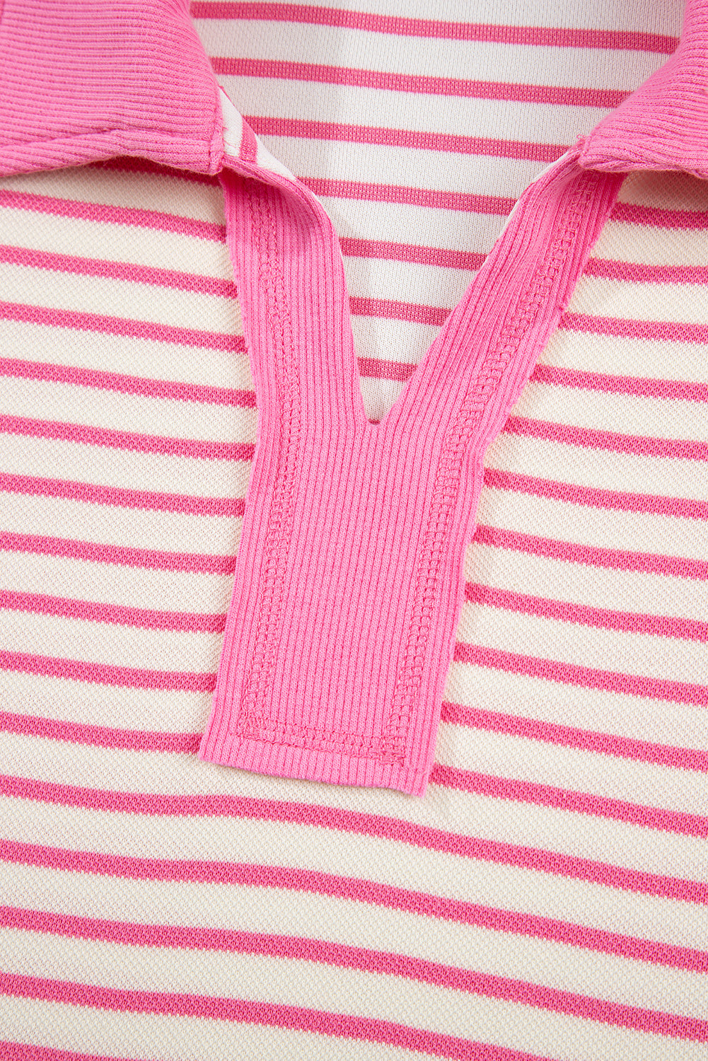 Modern Grace pink stripe two-piece set with collared V-neck pullover and matching skort, featuring drop shoulder design.