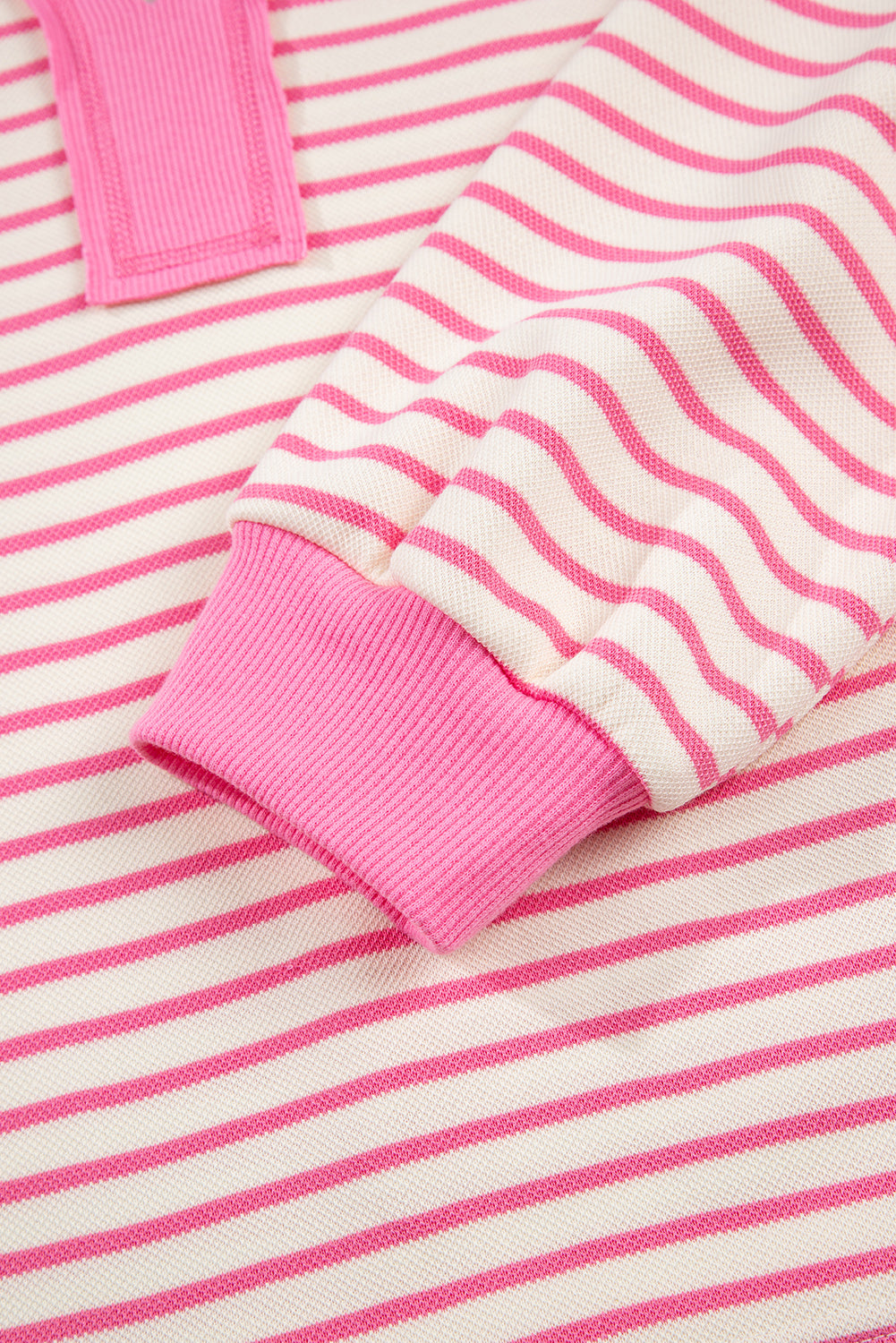 Pink stripe two-piece outfit featuring a collared V-neck pullover and matching skort from Modern Grace.