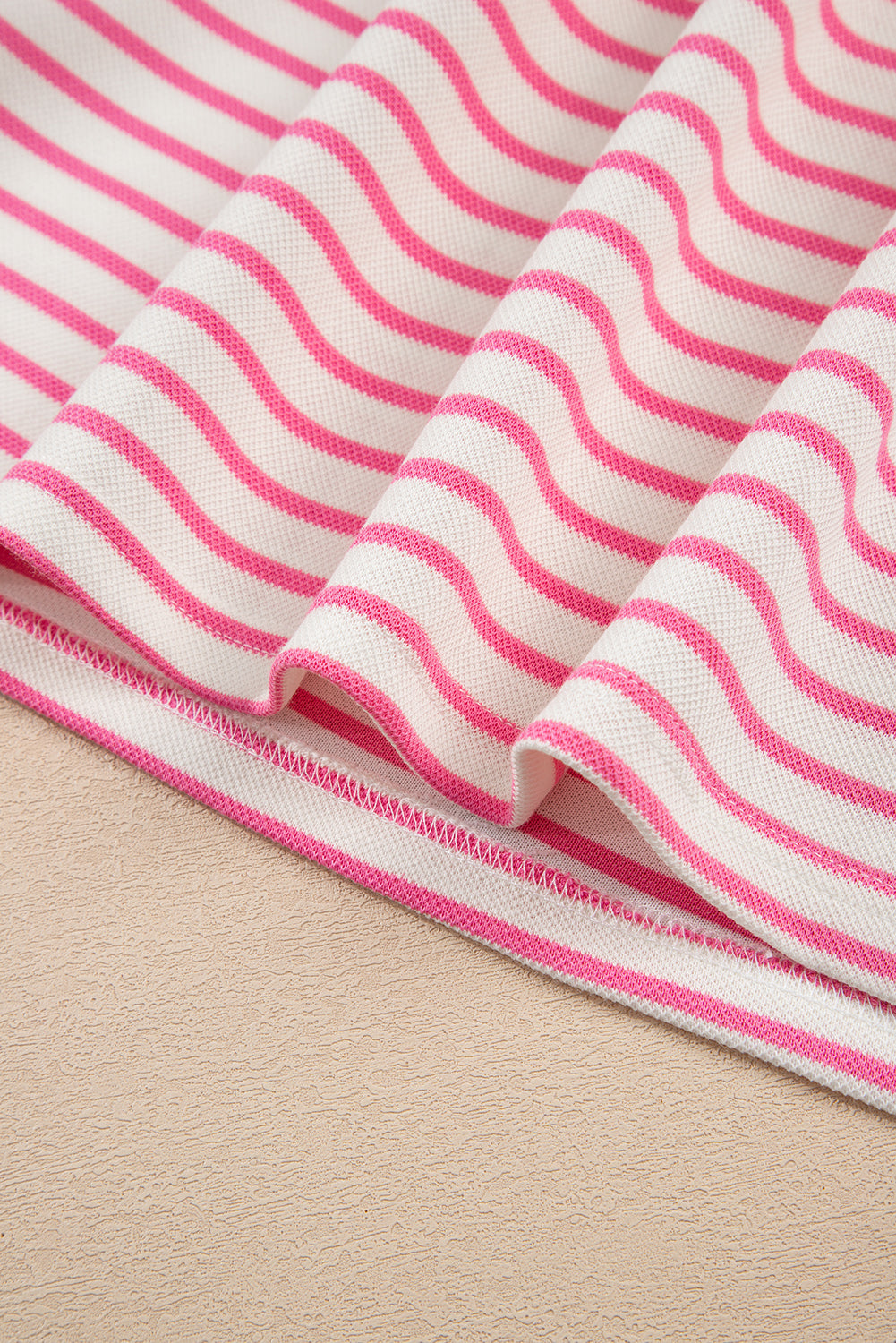 Modern Grace pink stripe two-piece outfit with collared V-neck pullover and matching skort, featuring drop shoulder design.