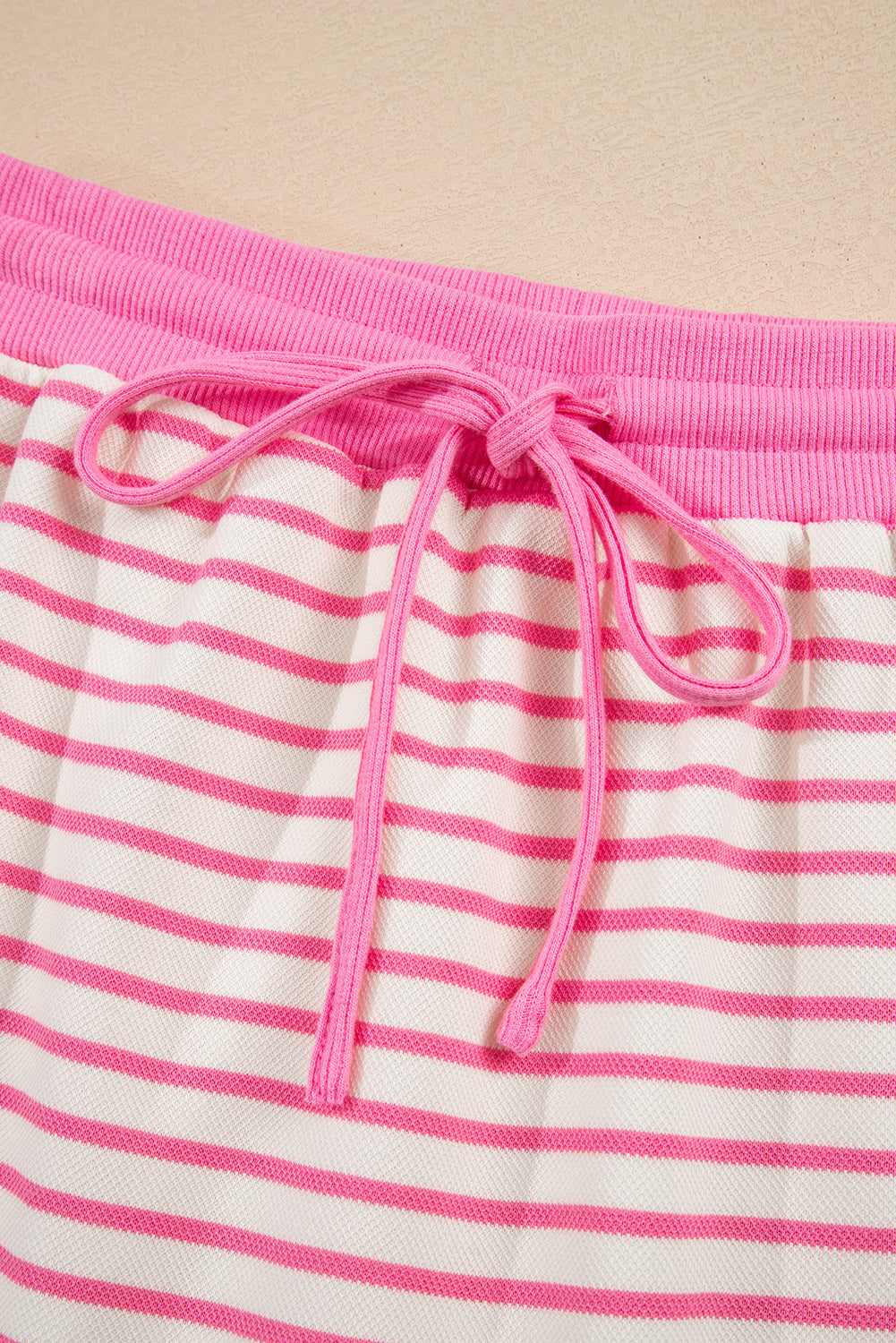 Modern Grace pink stripe two-piece set with collared V-neck pullover and matching skort, perfect for casual wear.