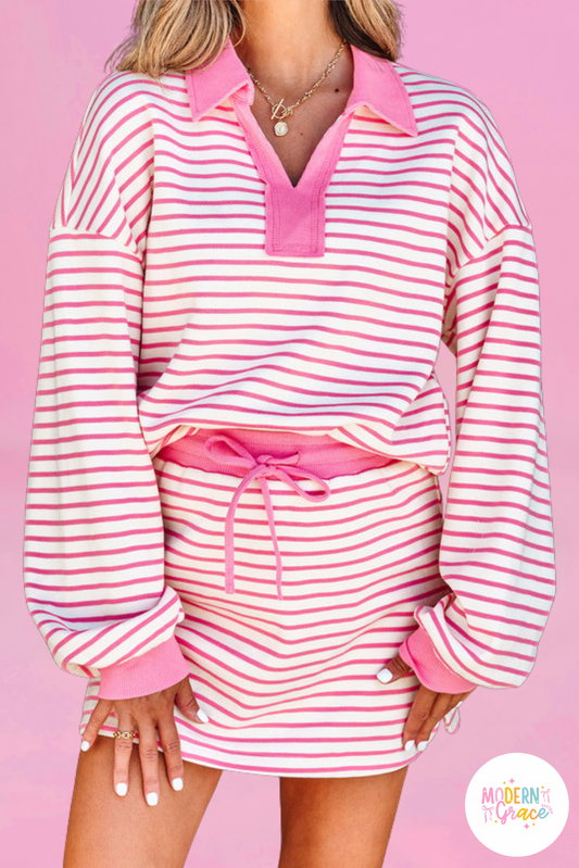 Pink stripe two-piece set from Modern Grace featuring a collared V-neck pullover and matching skort, casual and stylish.