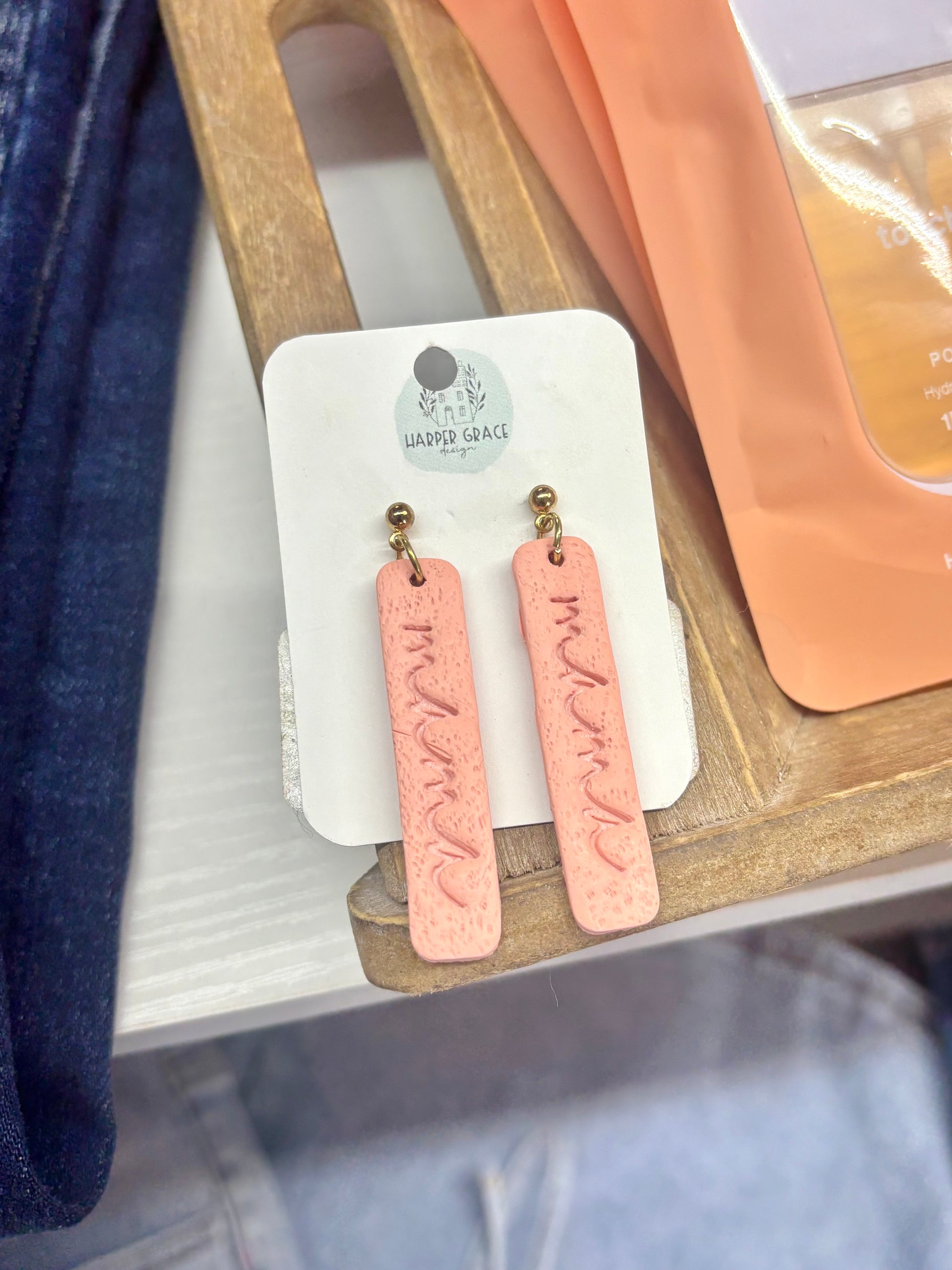 Modern Grace Mama Earrings in five colors, featuring stylish hoop design with colorful beads for a trendy accessory look.