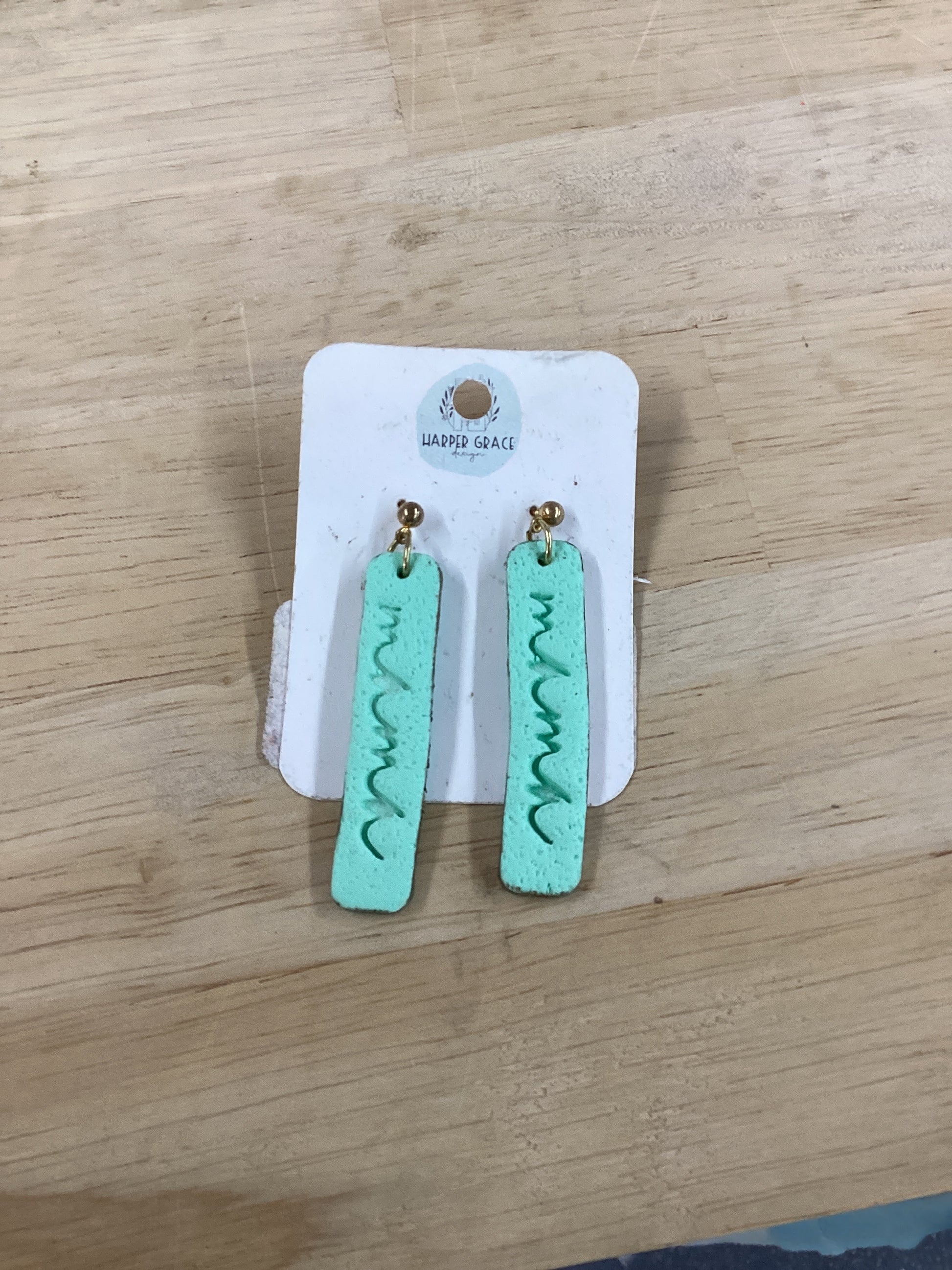 Modern Grace Mama Earrings in five colors, featuring stylish, lightweight hoop design with elegant metal accents.