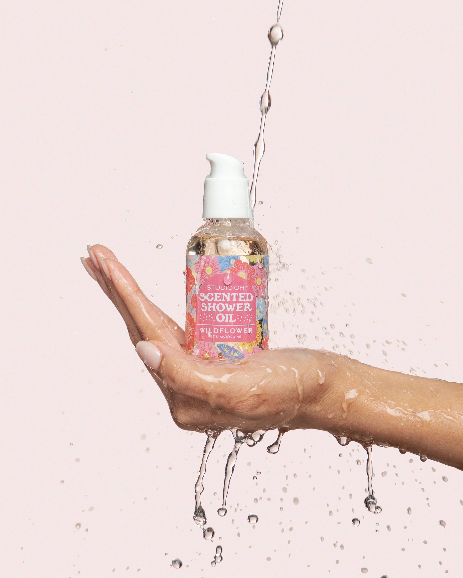 Studio Oh! Butterfly Blossoms Scented Shower Oil for bath and body, showing the elegant bottle with floral design.