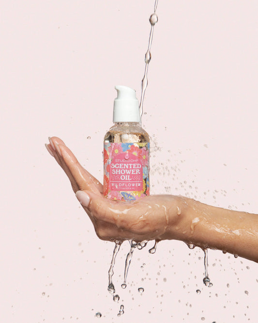 Studio Oh! Butterfly Blossoms Scented Shower Oil for bath and body, showing the elegant bottle with floral design.