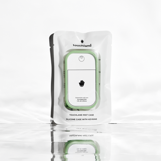 Touchland Mist Case in Matcha Green showcasing a sleek, portable hand sanitizer holder with a vibrant green design.