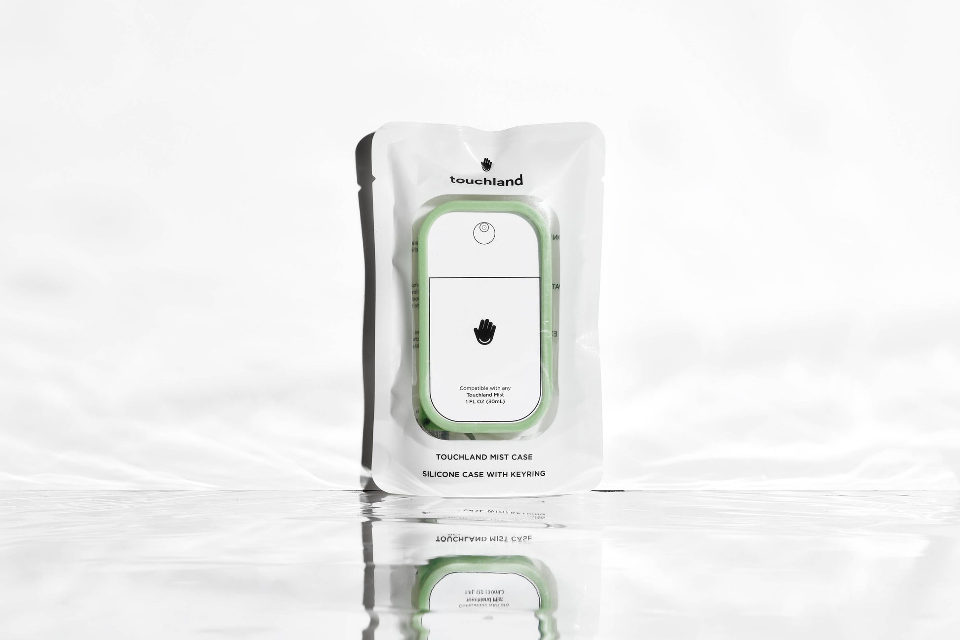 Touchland Mist Case in Matcha Green, a sleek protective cover for hand sanitizer bottles, with a vibrant green design.